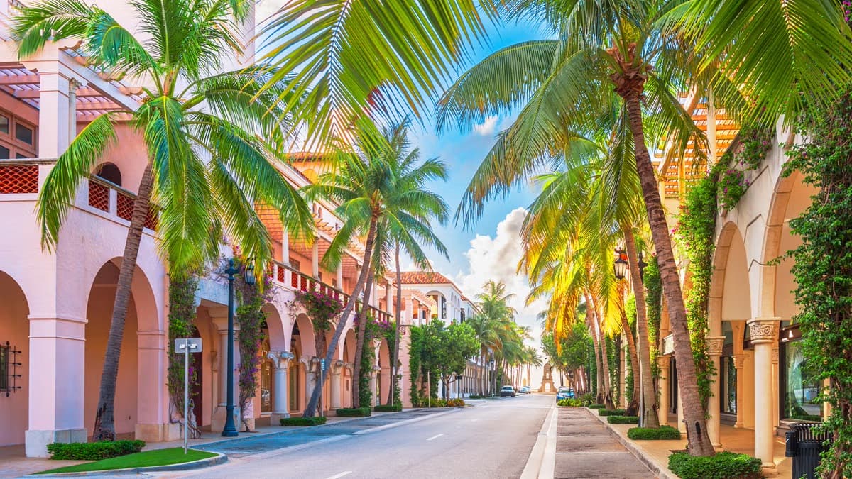 Palm-lined Mediterranean Revival arcades along Worth Avenue, Palm Beach