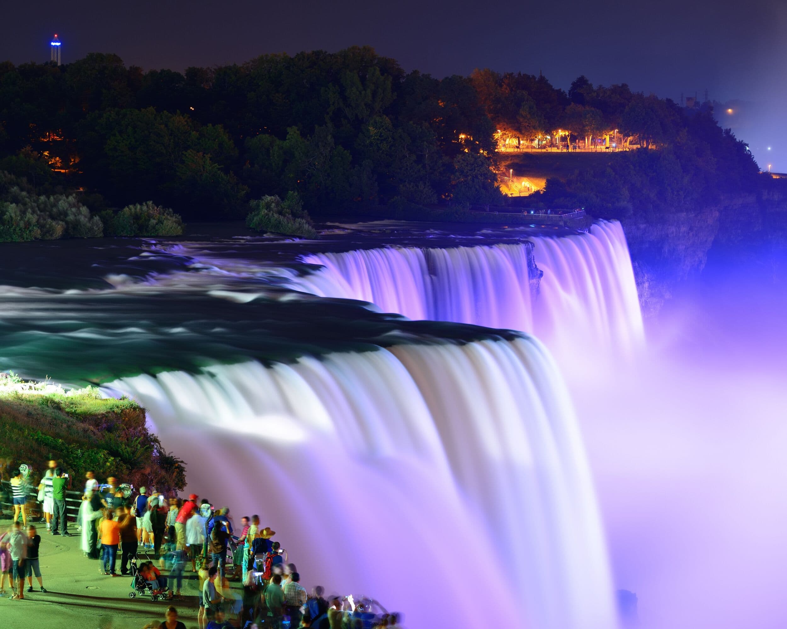 Niagara Falls illuminated at night, viewed from the New York side