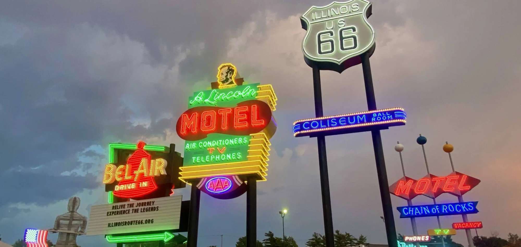 Neon signage on a historic American main street at night